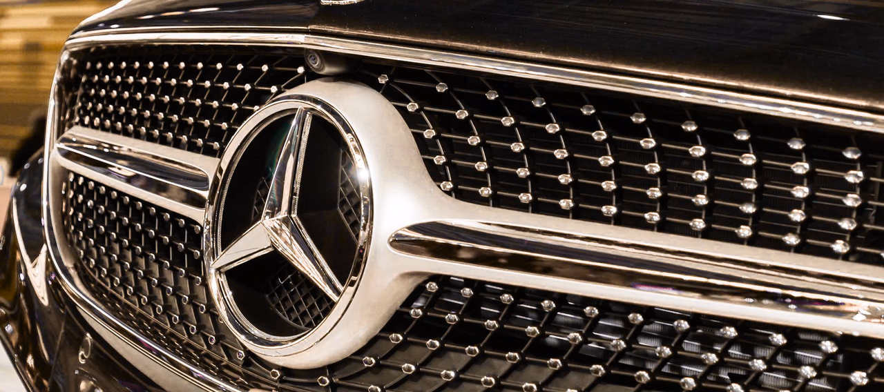Close-up of a Mercedes-Benz grille on a black executive chauffeur car